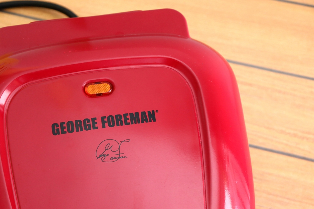 George Foreman Grill on wooden background.
