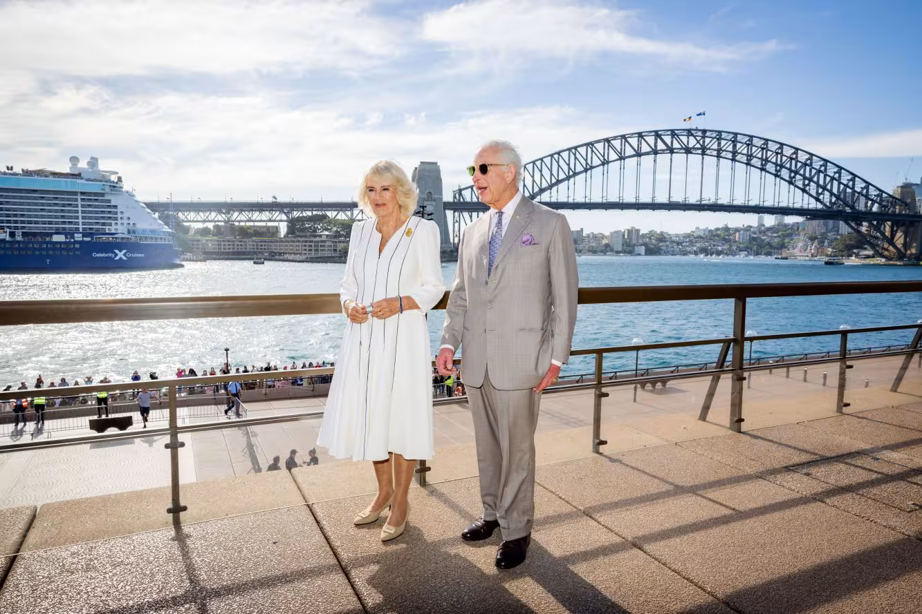 King Charles III and Queen Camilla front of the Sydney Harbour Bridge