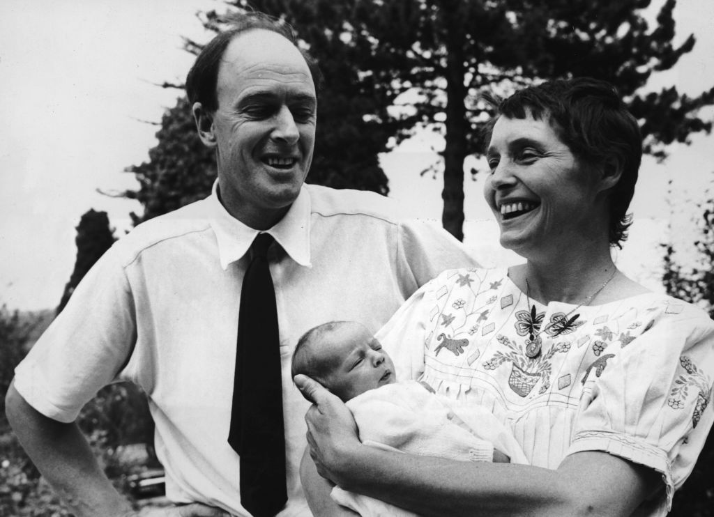 Welsh-born author Roald Dahl (1916 - 1990) smiles with his wife, American actor Patricia Neal and their newborn daughter Lucy