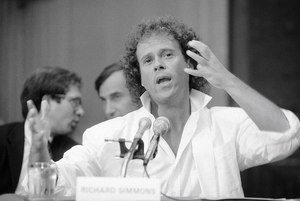 American fitness coach Richard Simmons speaks into microphone