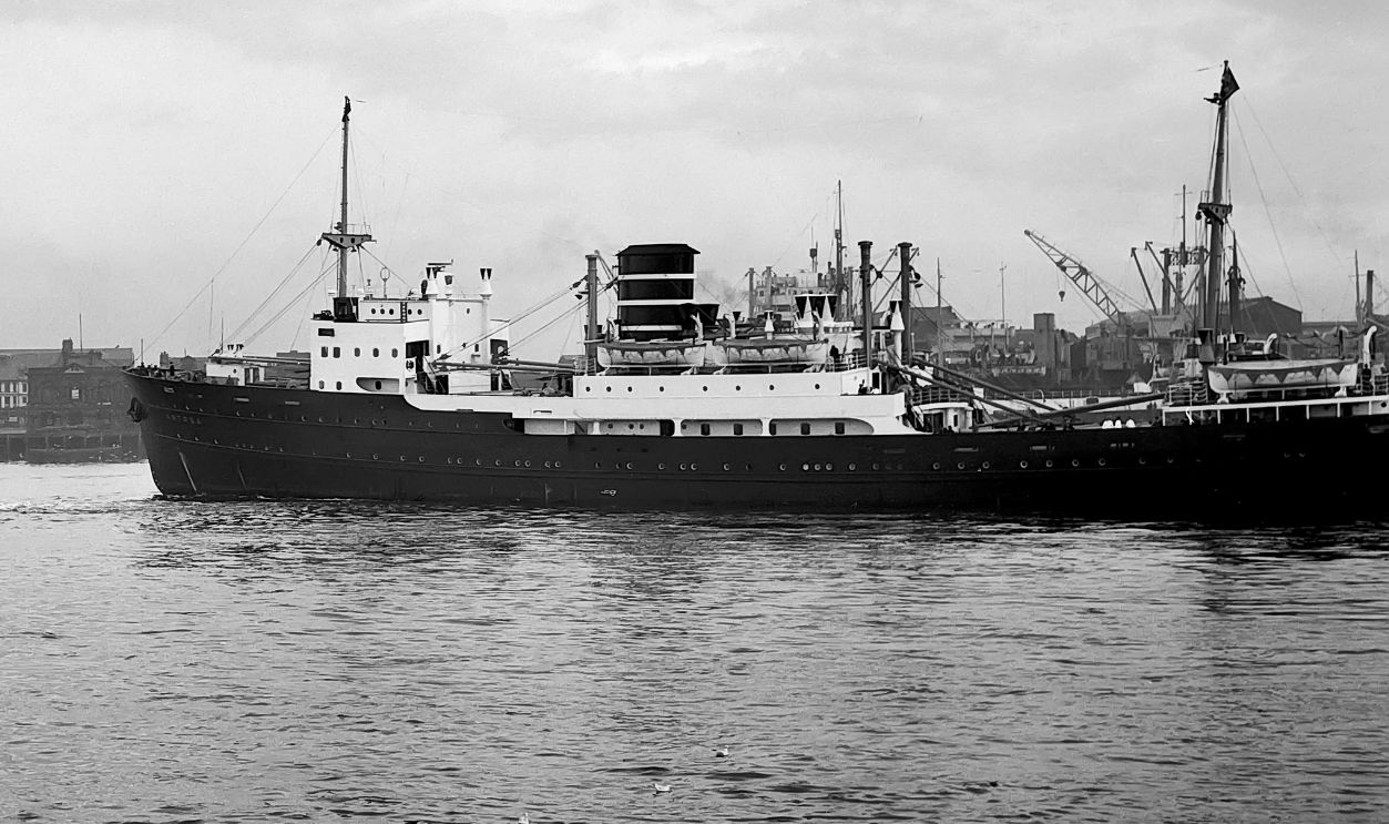 Bergen line ship Astrea leaving the tyne in the late 1940's early 1950's. Towed by a tyne tug passing the Customs house, Mill Dam and St. Hilda's colliery; South Shields, Tyne and Wear, England Bergen line ship Astrea leaving the tyne in the late 1940's early 1950's. Towed by a tyne tug passing the Customs house, Mill Dam and St. Hilda's colliery; South Shields, Tyne and Wear, England.