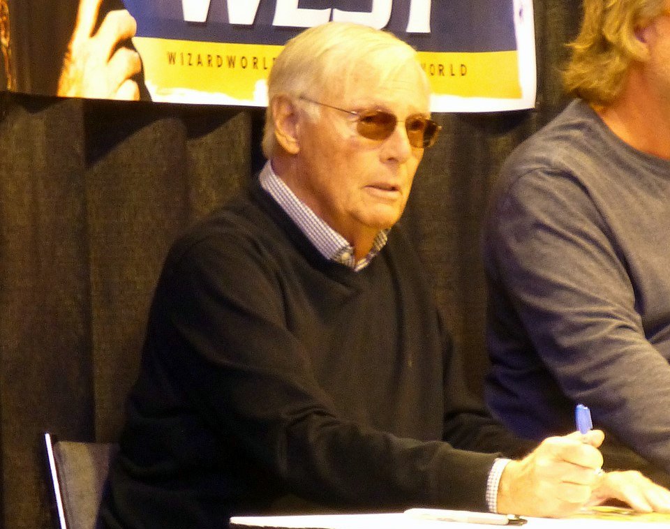 Adam West signing autographs 