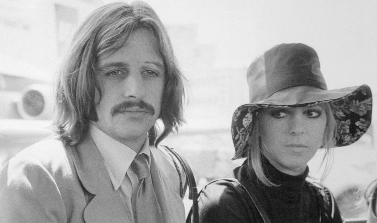 Ringo Starr and Wife Maureen Starkey (Original Caption) Ringo on vacation...Ringo Starr, famed drummer of The Beatles, and his wife, Maureen, arrive here on June 27th on their way to a nearby vacation resort.