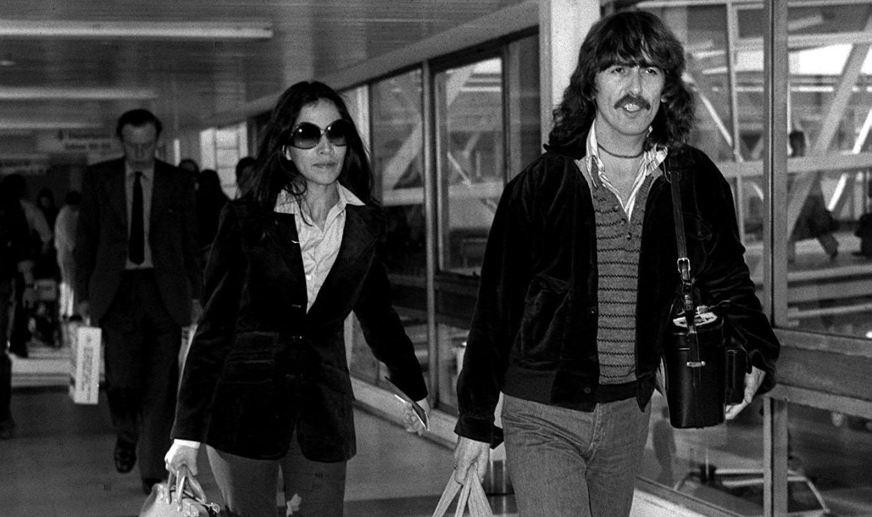 George Harrison & Olivia Former Beatle George Harrison and his girlfriend Olivia Arias at Heathrow Airport, London, having flown in from Los Angeles, California. ghgal 