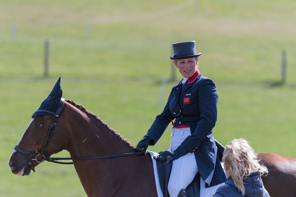 A smiling Zara Tindall riding her horse