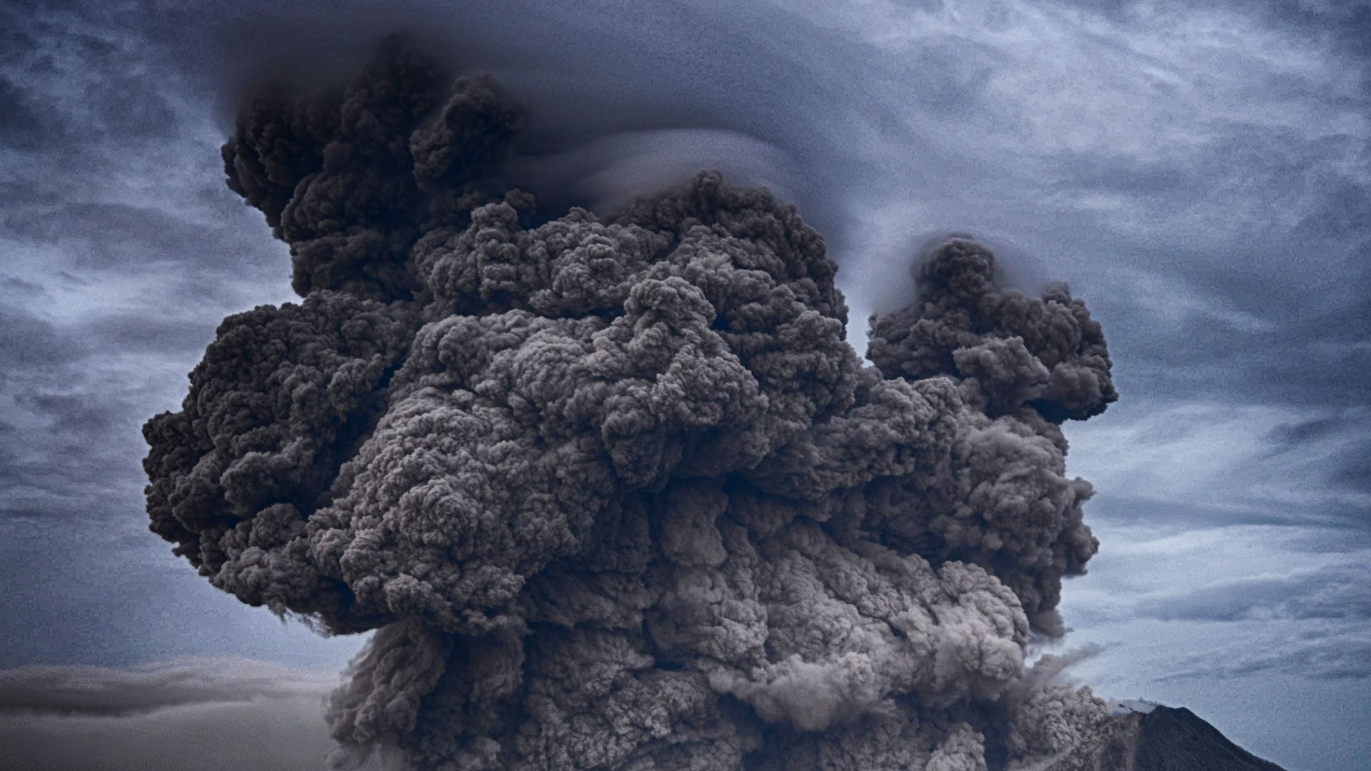 volcano eruption during daytime