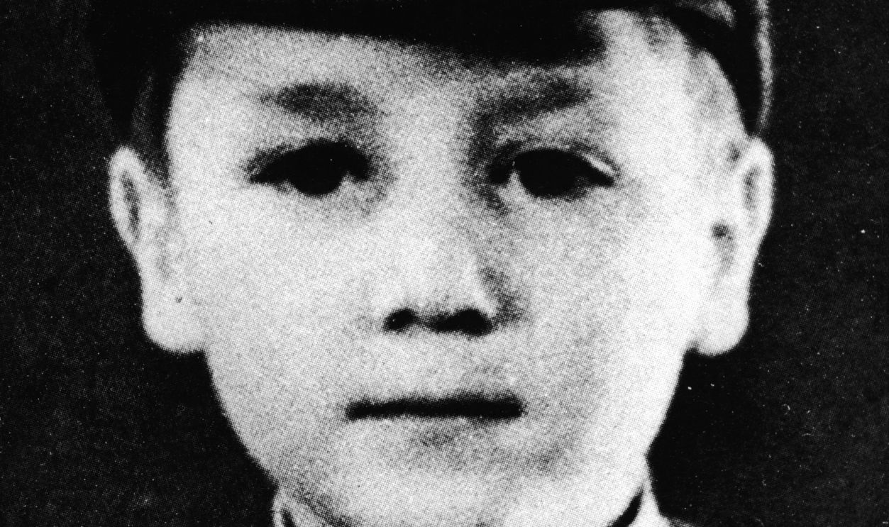 John Lennon As Young Boy Headshot portrait of British musician and songwriter John Lennon (1940 -1980), of the pop group The Beatles, as a young boy in a school uniform and cap, circa 1948.