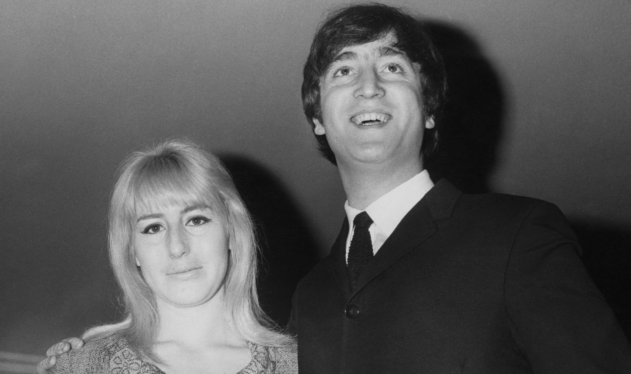Gettyimages - 886650298, John And Cynthia Lennon Musician, singer and songwriter John Lennon (1940 - 1980) of British rock group the Beatles with his first wife Cynthia during the launch of his book 'In His Own Write' at the Dorchester Hotel in London, 23rd April 1964.