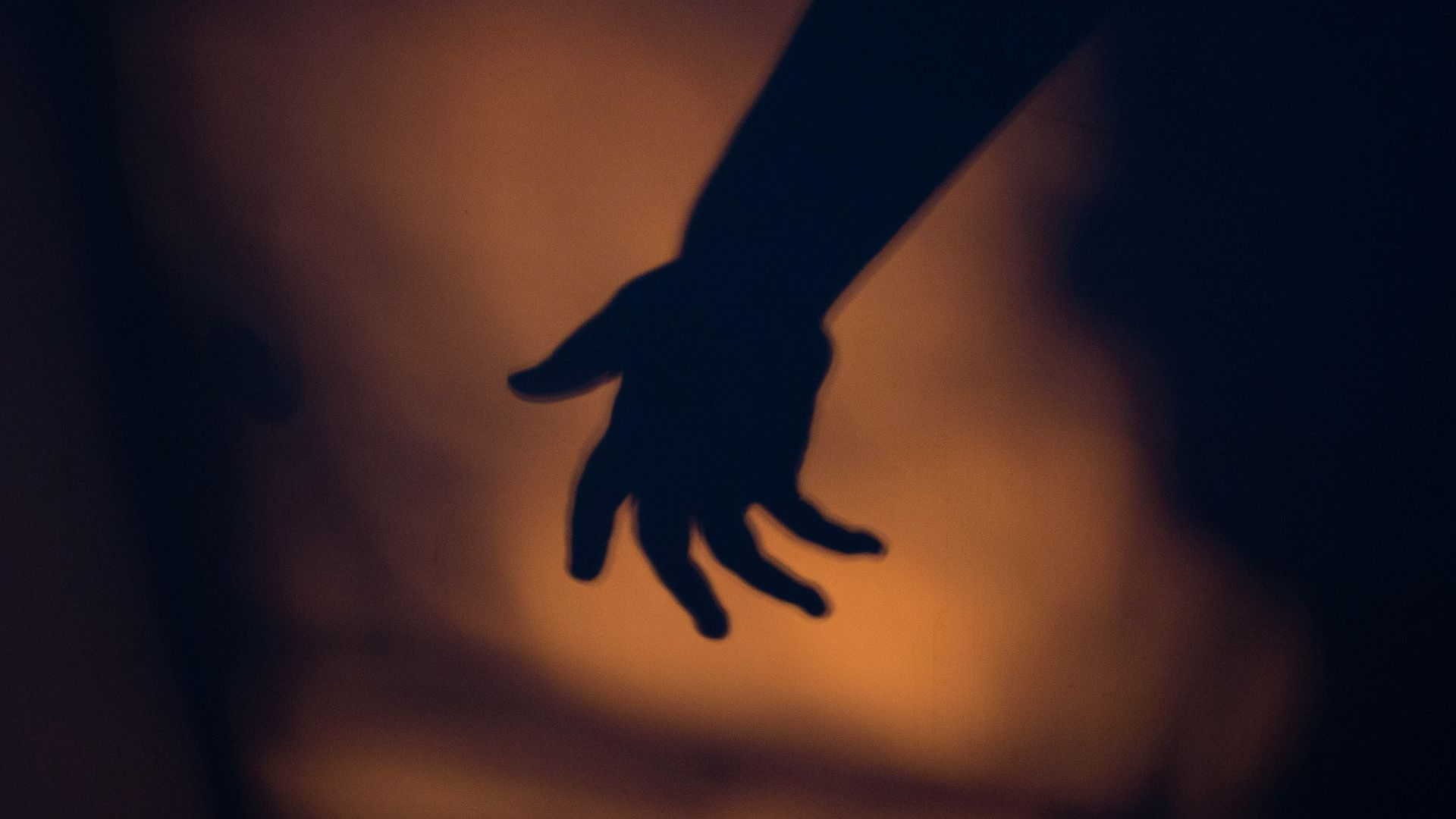 silhouette photography of human hand