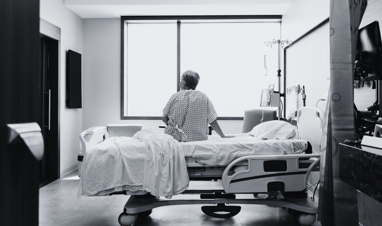 Gettyimages - 1945090686, Senior adult woman sits alone in her hospital room - stock photo The senior adult woman sits alone in her hospital room while she waits for her daughter.