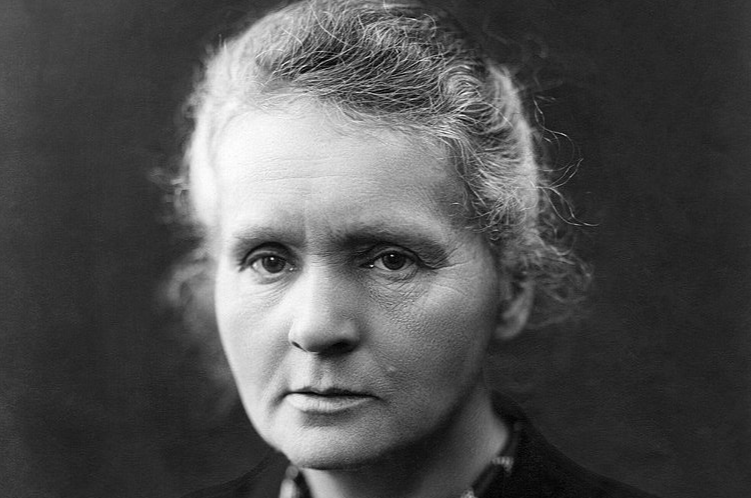 Grayscale Portrait Photo of Marie Curie in dark outfit