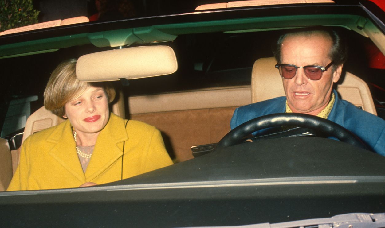 Married American couple, actors Rebecca Broussard and Jack Nicholson sighted, in a car, at Chasen's Restaurant, Beverly Hills, California, October 5, 1990.