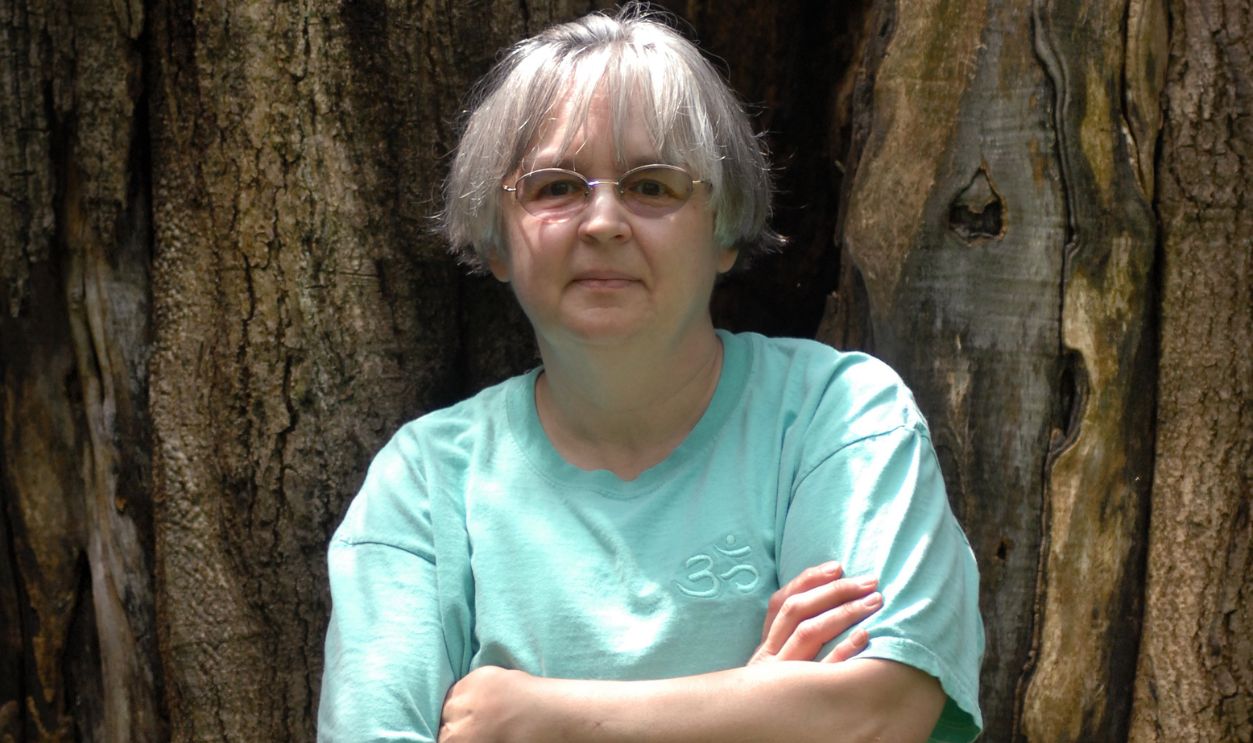 STAFF PHOTO BY Shawn Patrick Ouellette, Friday, May 26, 2006: Author Tabitha King in front of an old Walnut tree at her home in Bangor.