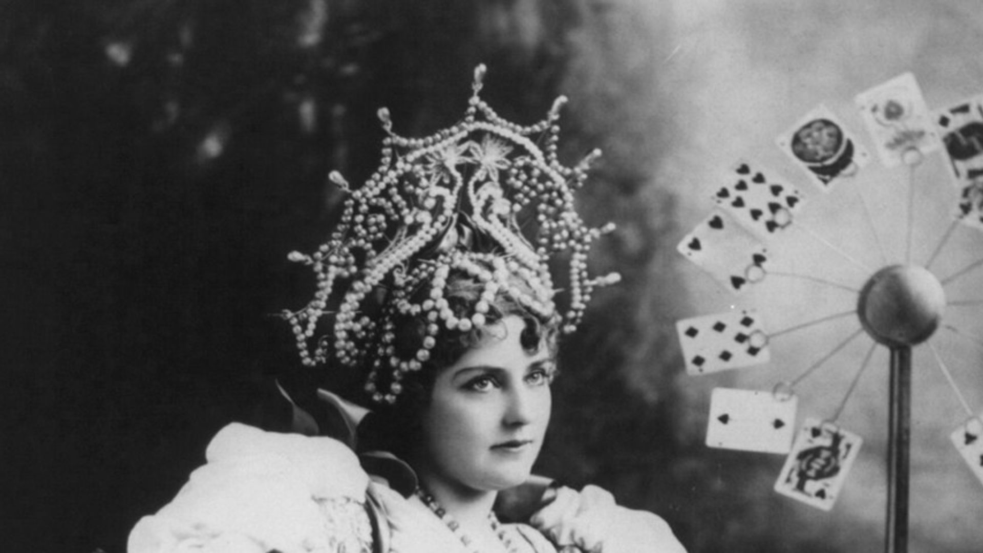 File:Lillian Russell, 1861-1922, three-quarters length, seated, facing right; with cards at table, in the