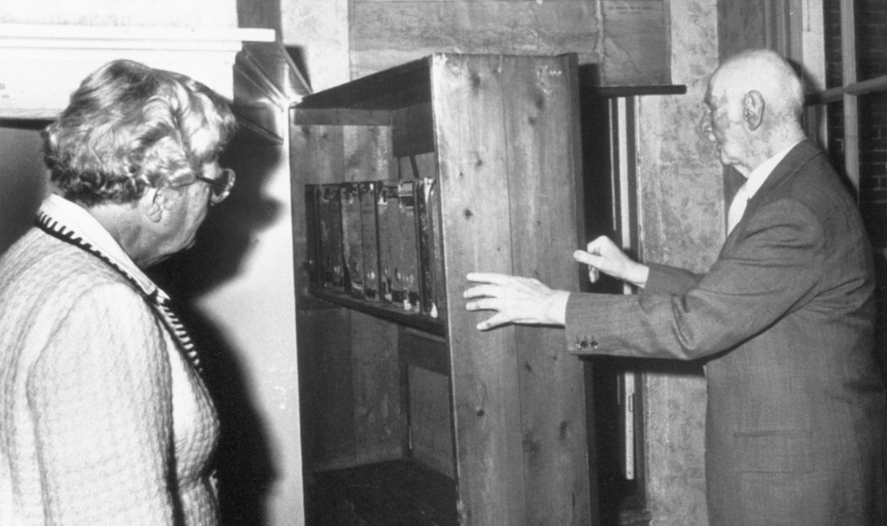 Mr. Otto Frank, father of Anne Frank, shows Queen Juliana of The Netherlands the hiding place of the Frank family during World War II. The Queen visited the Anne Frank House in Amsterdam at the occasion of the 50th anniversary of the birth of Anne Frank.