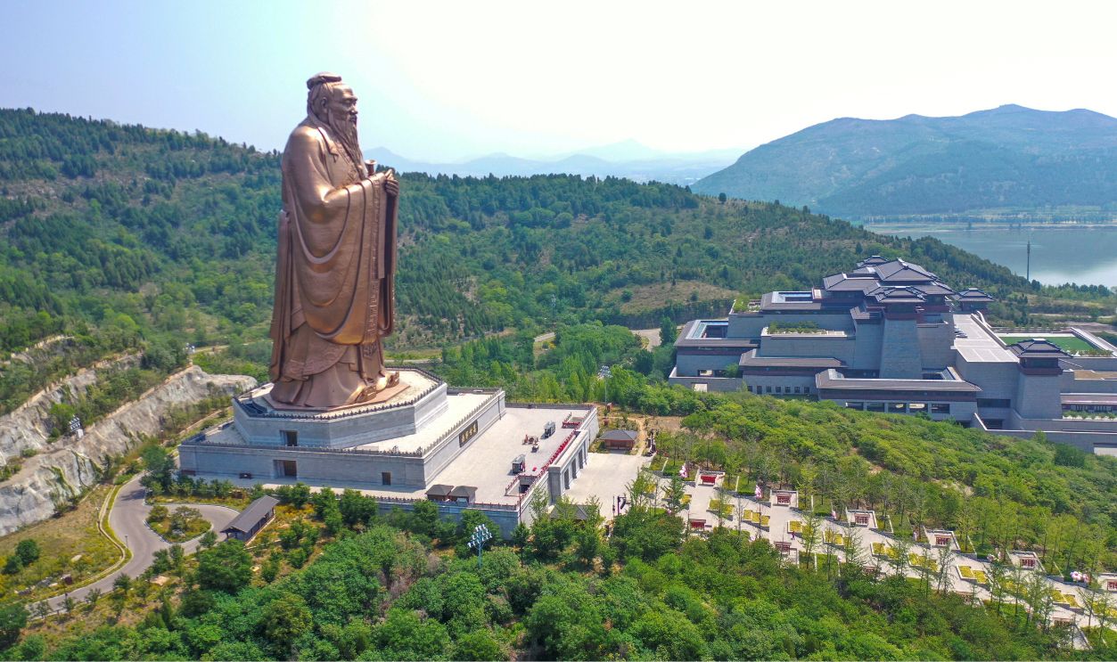 A drone photo shows the sculpture of Confucius at Nishan Sacredland scenic spot in Qufu, east China's Shandong Province, May 21, 2025. Qufu, the birthplace of the renowned philosopher Confucius, has been blending Confucian culture with tourism, featuring a variety of art performances, exhibitions and folk culture activities, which attract many visitors each year.