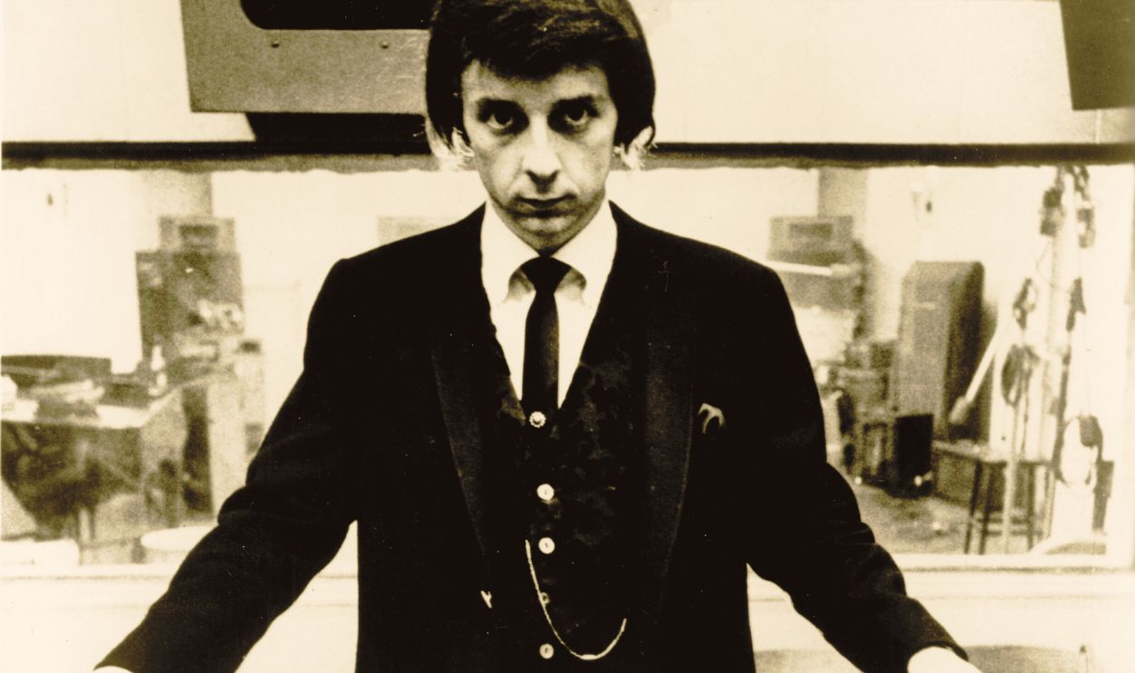 LOS ANGELES - 1966: Producer Phil Spector poses at the mixing board during a recording session at Gold Star Studios in 1966 in Los Angeles, California. 