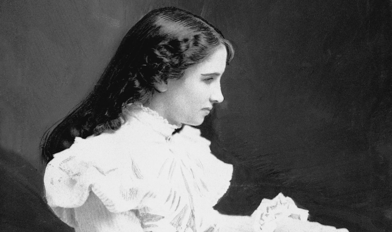 Gettyimages - 515581478, Helen Keller Sitting at a Desk Young Helen Keller sits with a book at her desk. Due to illness, Keller suffered loss of sight and hearing at the age of 19 months.