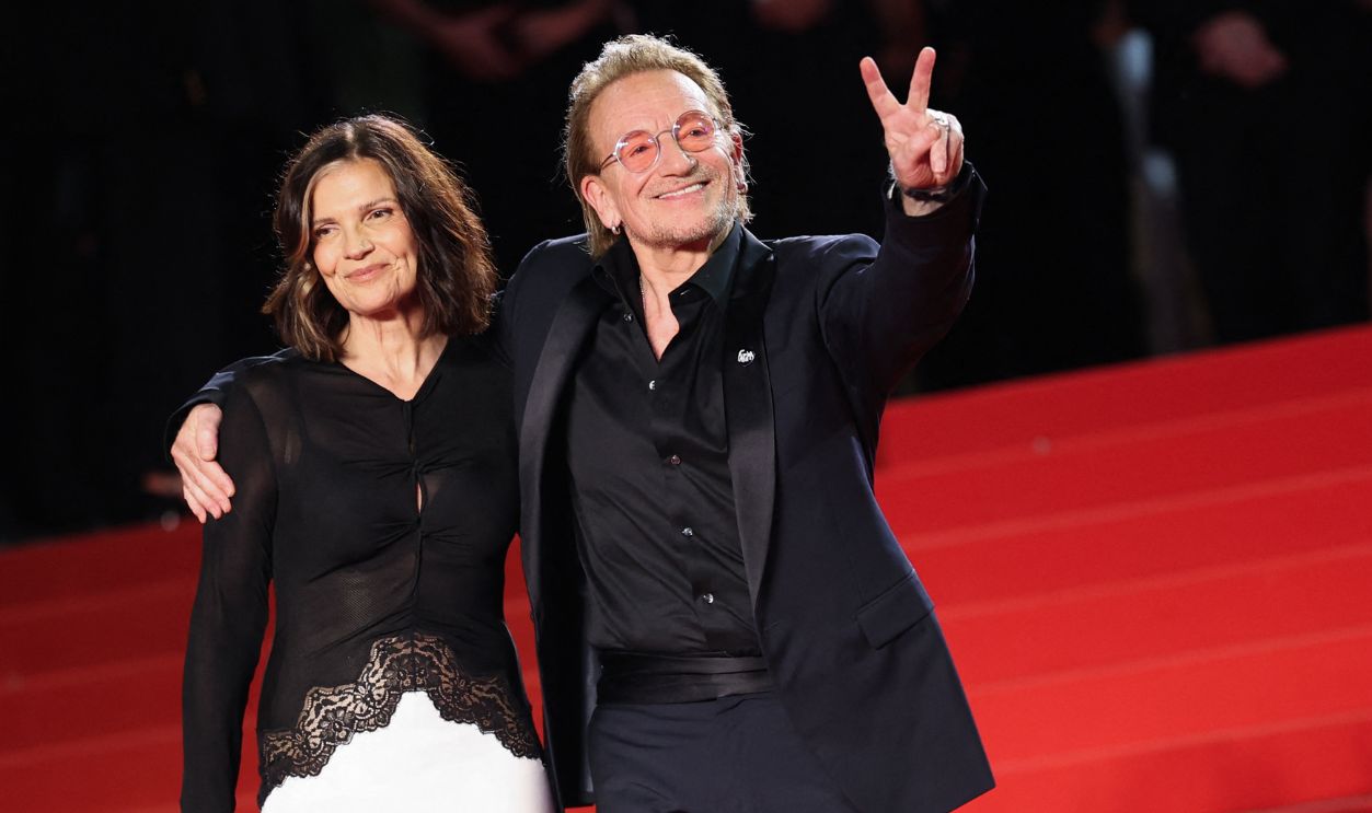 Irish singer-Songwriter and executive producer Bono (R) and his spouse Irish activist and businesswoman Ali Hewson leave after the screening of the film 