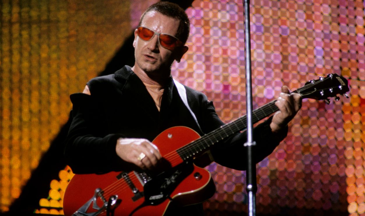 WEMBLEY STADIUM Photo of BONO and U2, Bono performing live onstage on PopMart tour, playing Gretsch 6119 Chet Atkins Tennessean guitar