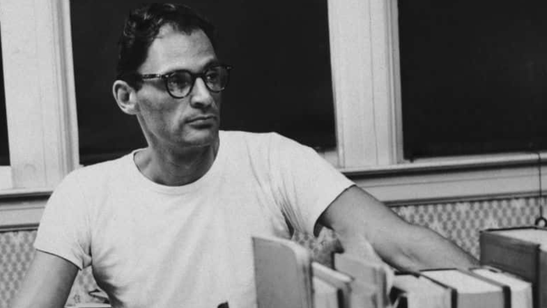 American playwright Arthur Miller (1915 - 2005) at his desk, circa 1955. 