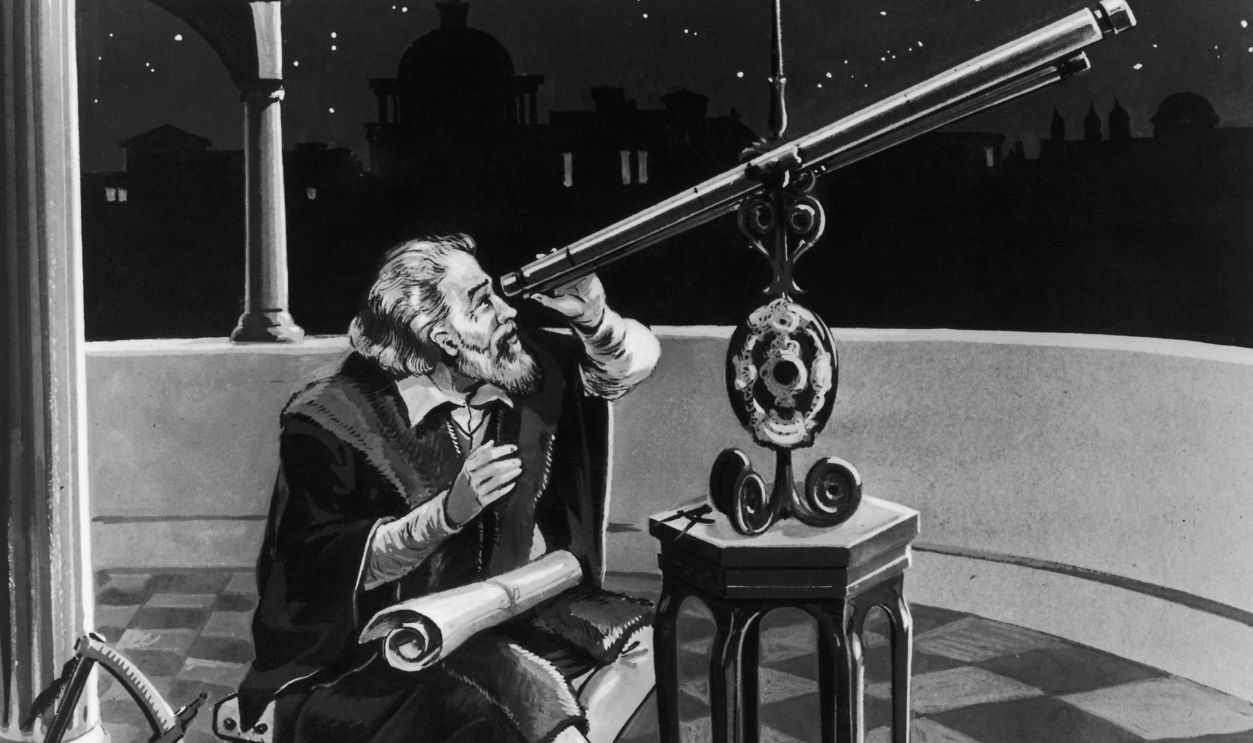 Italian astronomer and physicist, Galileo Galilei (1564 - 1642) using a telescope, circa 1620. 