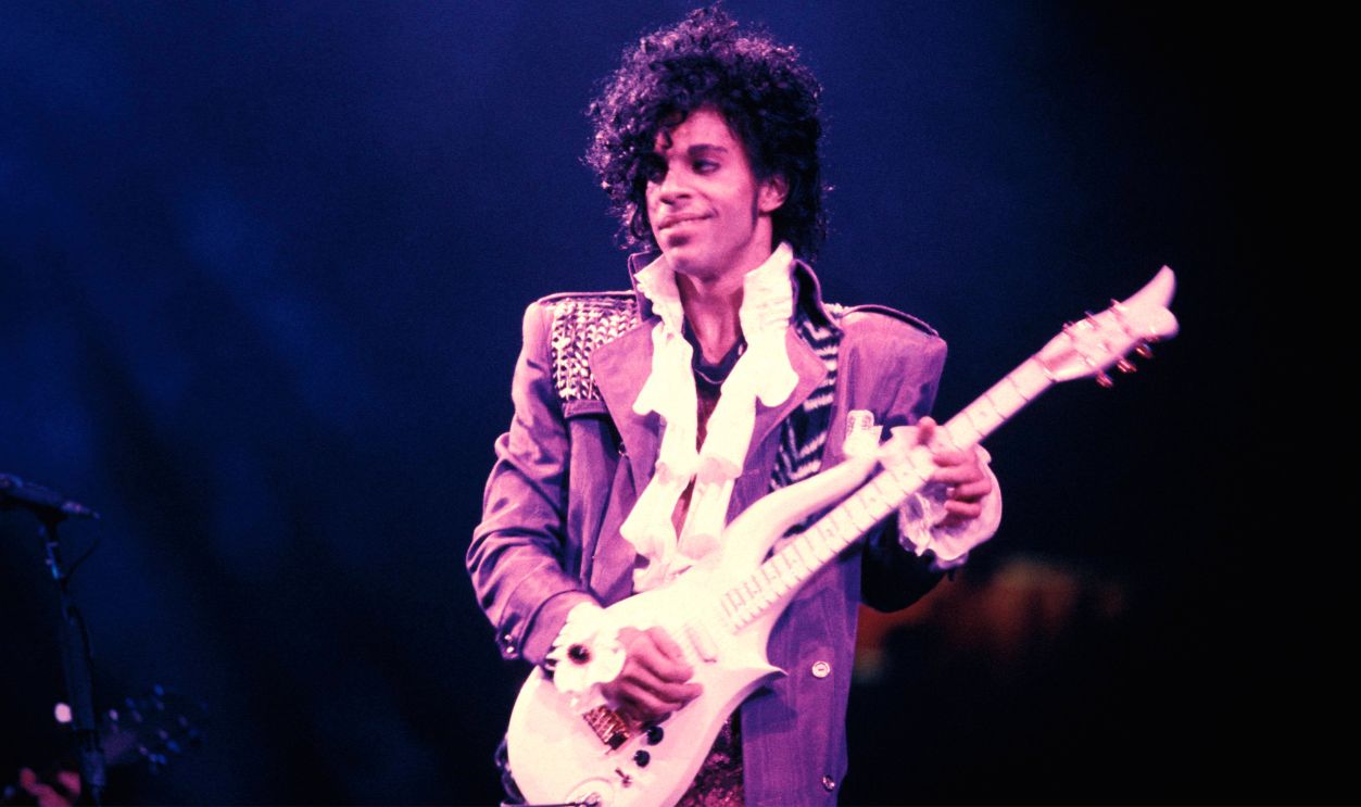RITZ CLUB Photo of PRINCE, Prince performing on stage - Purple Rain Tour 