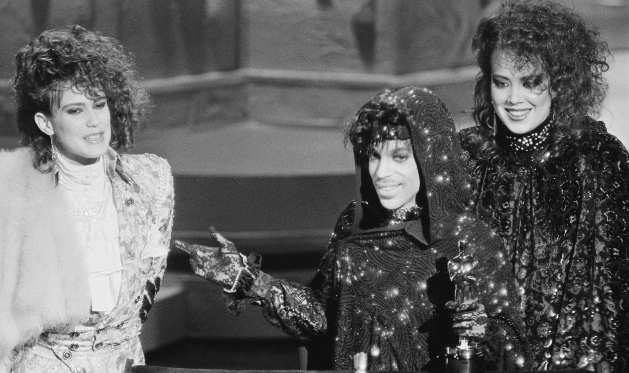 -Los Angeles, CA- Prince and members of his group accept their Oscar for Best Original Song Score for 