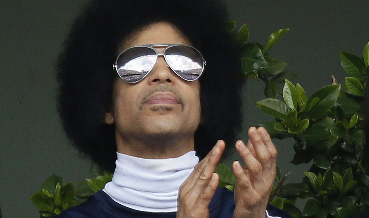 US singer Prince attends the French tennis Open round of sixteen match between Spain's Rafael Nadal and Serbia's Dusan Lajovic at the Roland Garros stadium in Paris on June 2, 2014
