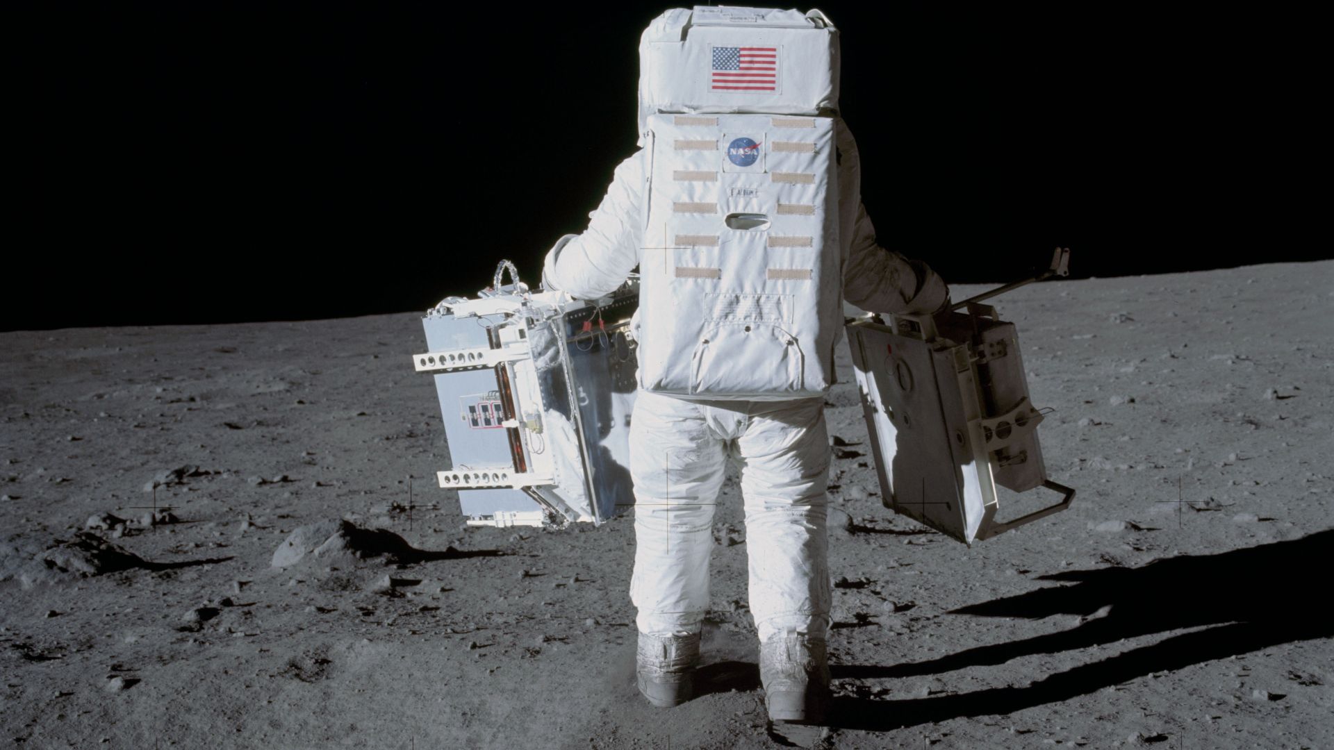 File:AS11-40-5942 - Apollo 11 - Apollo 11 Mission image - Astronaut Edwin Aldrin carries experiments to deployment area - NARA - 16685259.jpg
