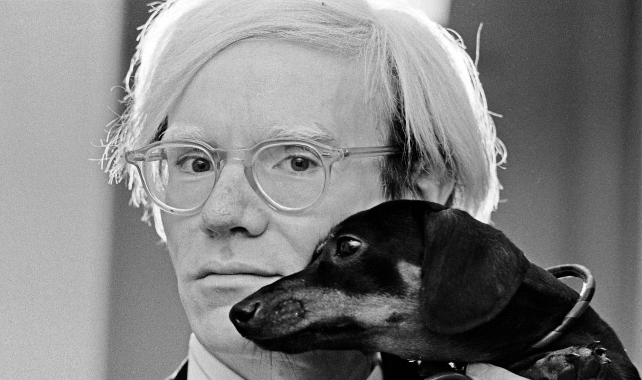 Andy Warhol poses with his beloved dachshund Archie in November 1973. 
