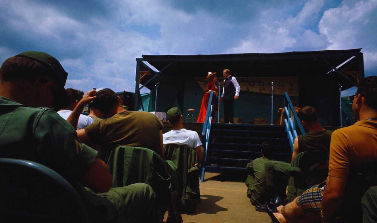 Gettyimages - 517771568, Troops Watching a Musical Performance (Original Caption) Martha Raye performing in show Hello Dolly for troops at Camp David. Moments later she collapsed and was carried off the stage.