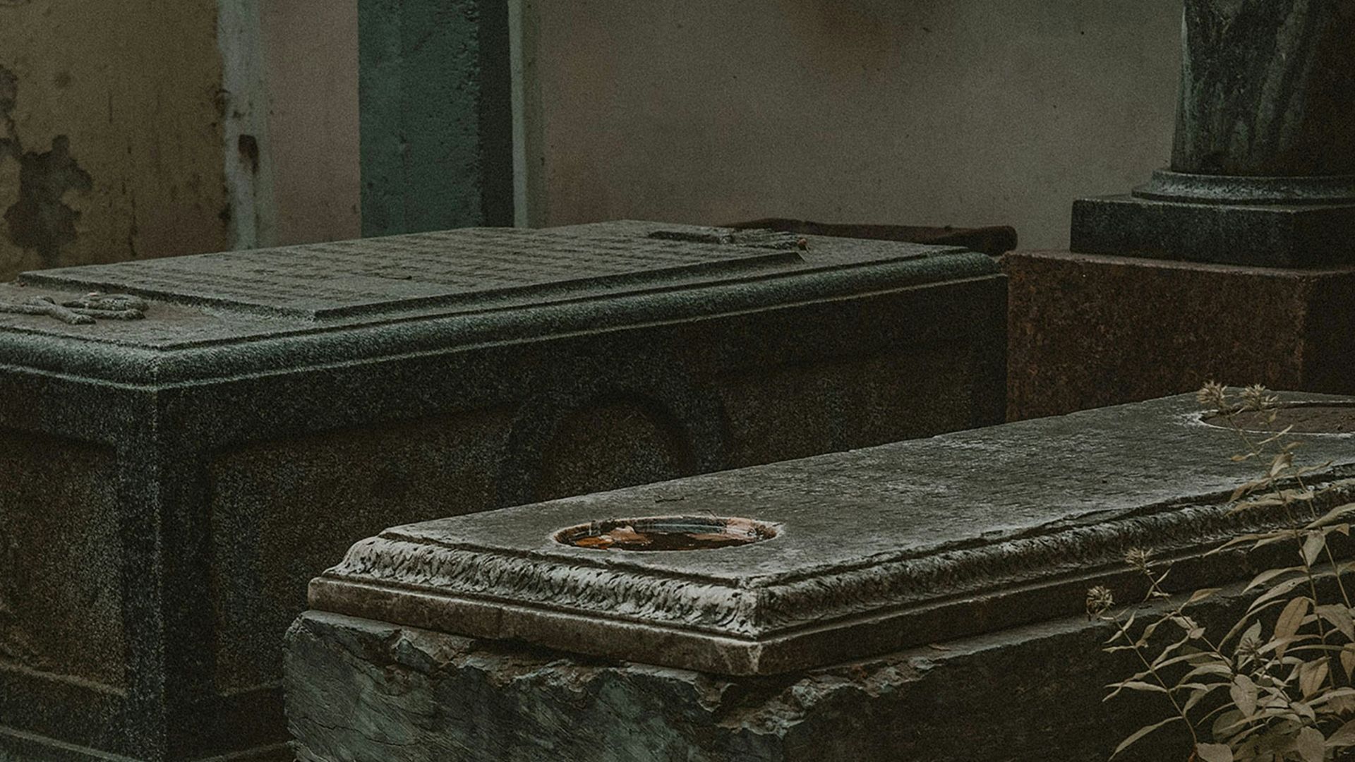 a couple of stone benches sitting next to each other