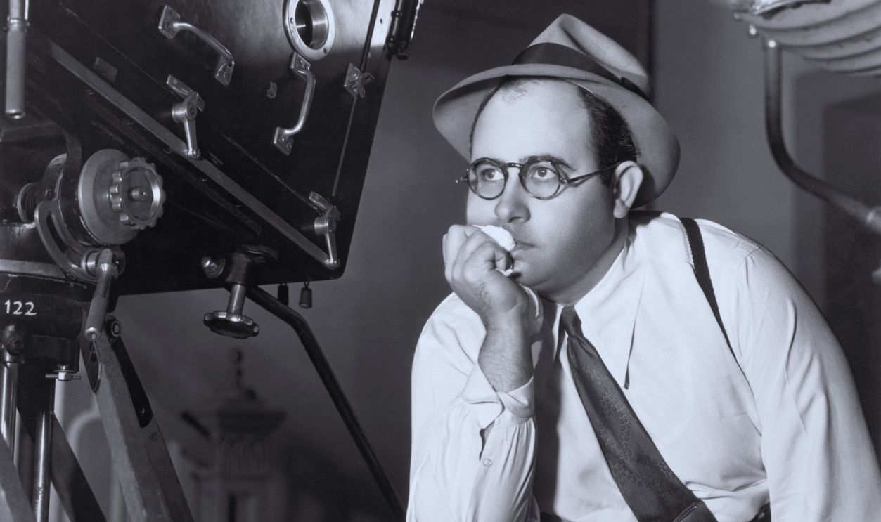 Gettyimages - 515588846, Norman Taurog Behind Camera/Leg On Chair (Original Caption) Norman Taurog, (1899-1981) American movie director, shown behind the camera with one leg on his director's chair. Ca. 1940s.