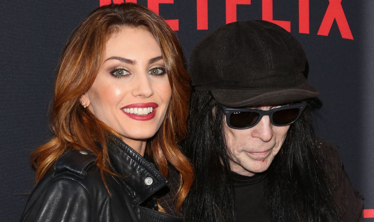 Mick Mars (R) and Seraina Schonenberger (L) attend the Premiere Of Netflix's The Dirt at ArcLight Hollywood on March 18, 2019 in Hollywood, California.