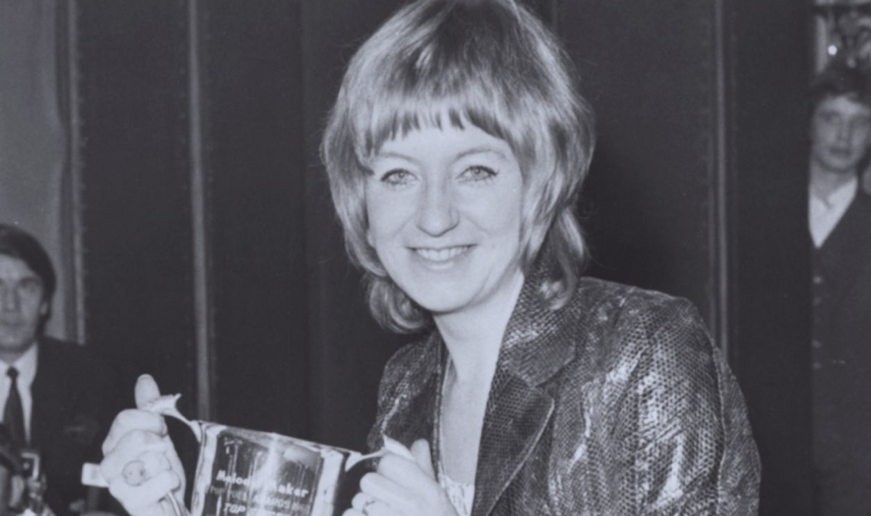 Gettyimages - 505808742, Christine Perfect Singer Christine Perfect, later known at Christine McVie, holding her cup after being voted as Britain's number one girl singer, at the Melody Maker pop poll awards in the Waldorf Hotel, London, September 17th 1969.