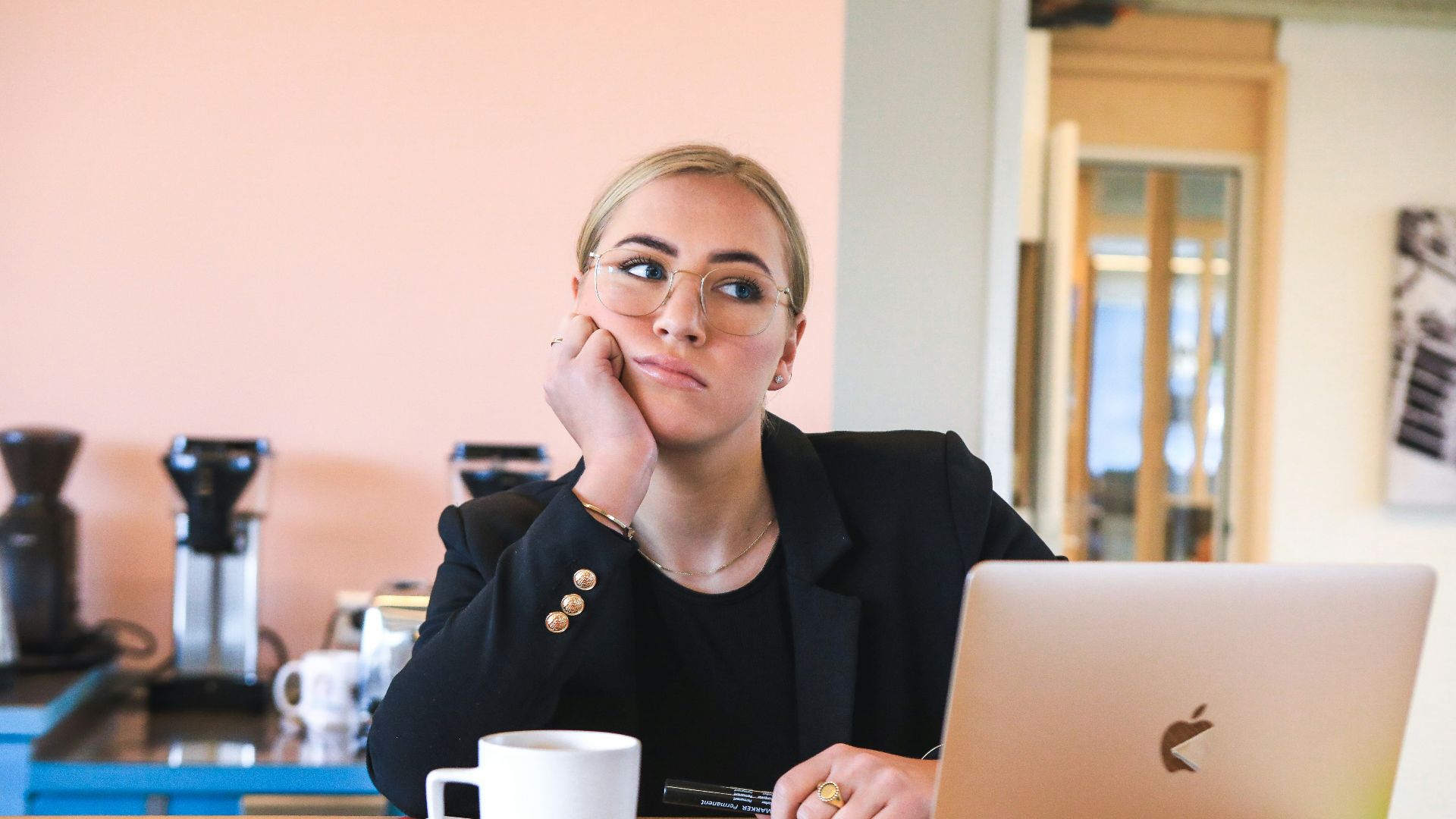 woman in black long sleeve shirt using macbook