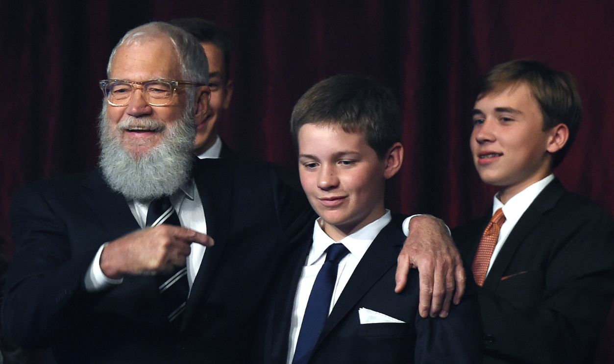 Honoree David Letterman (C), with wife Regina Lasko, greets his son Harry during the show at the 20th Annual Mark Twain Prize for American Humor at the Kennedy Center in Washington, DC, on October 22, 2017. 