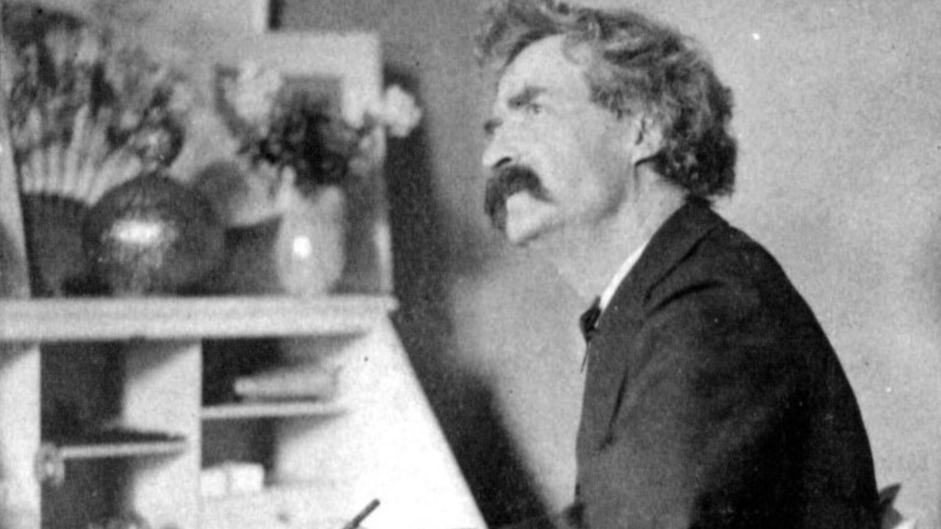 File:Mark Twain pondering at desk - part.jpg