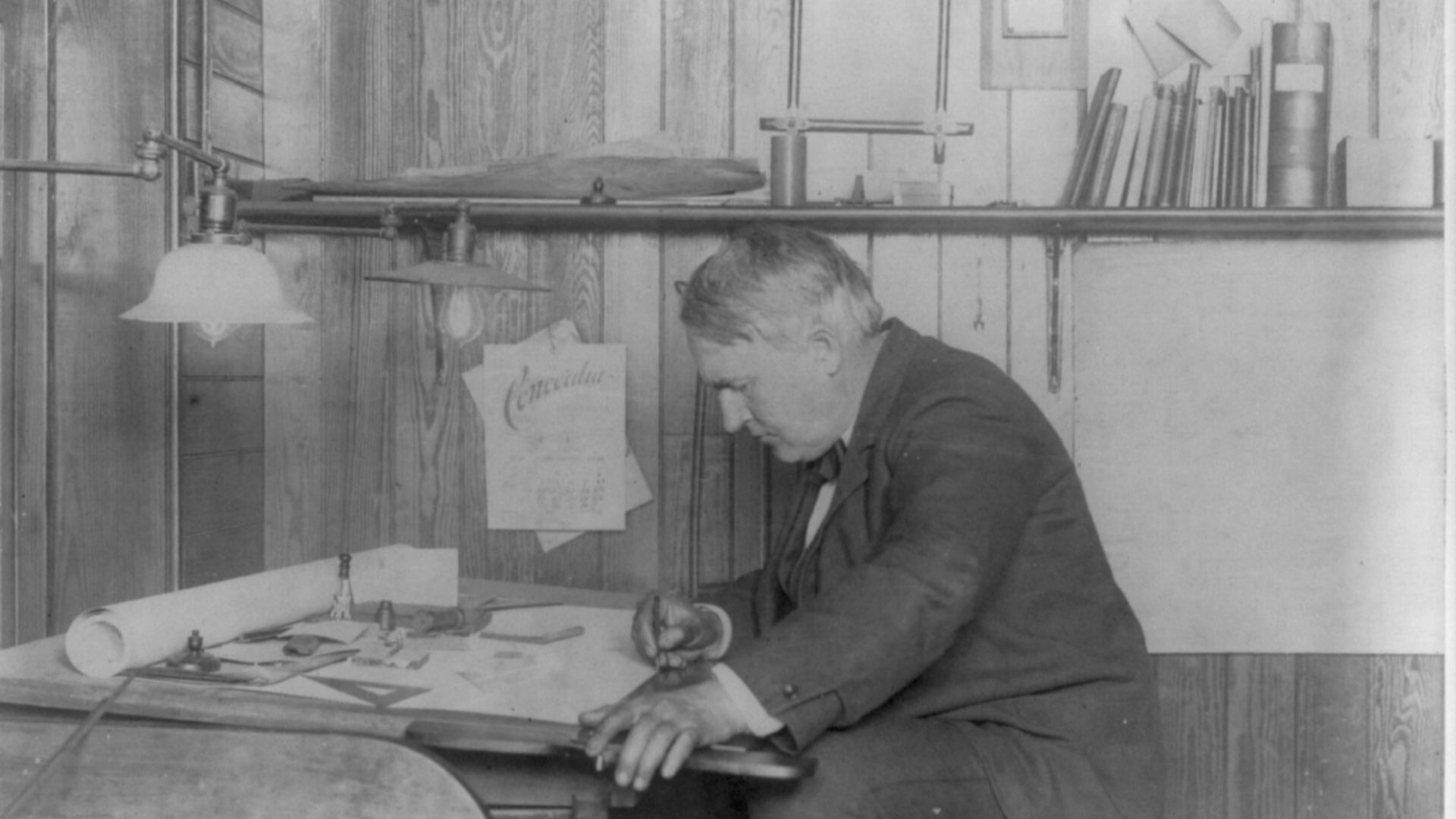 File:Thomas Alva Edison, 1847-1931, left profile, seated at his desk, writing LCCN2005687287.jpg