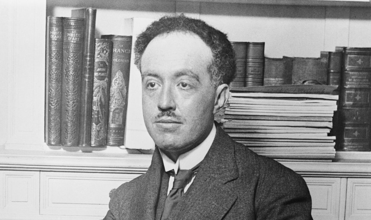 Portrait of Louis Victor Pierre Debroglie Sitting in Front of Bookshelf