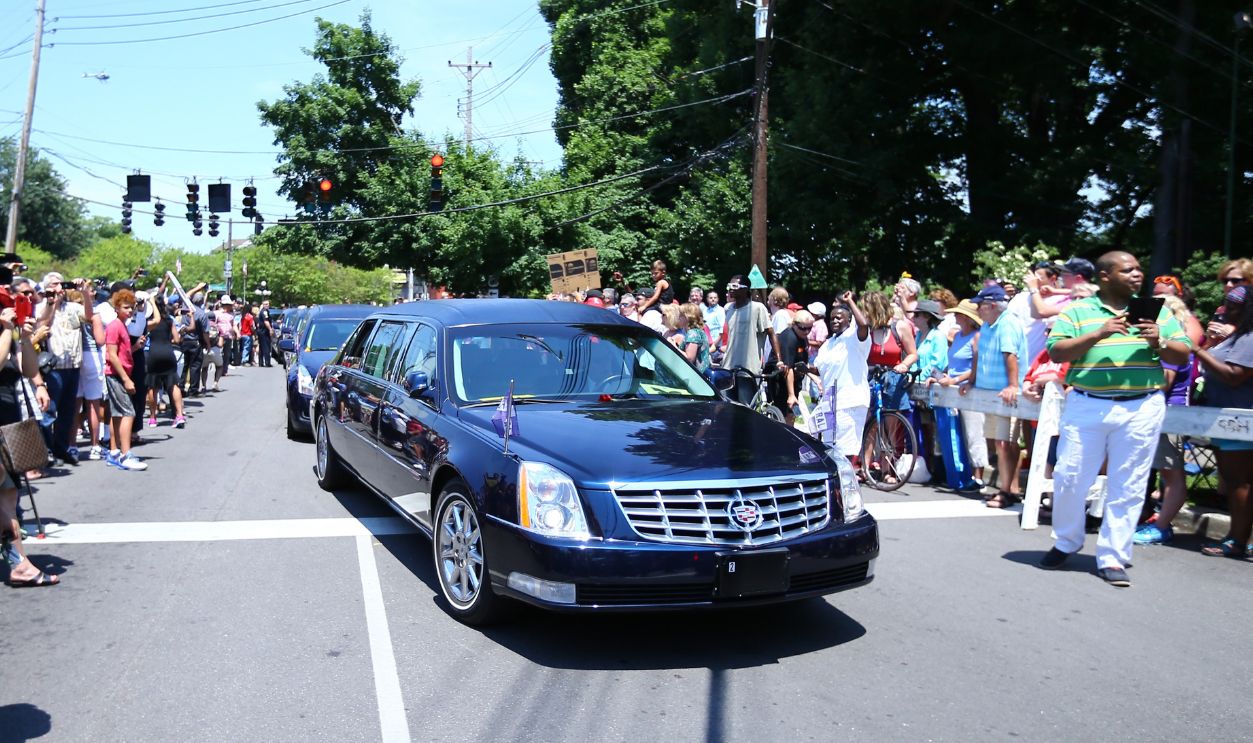 Fans of professional boxer Muhammad Ali are seen during a public funeral procession and memorial service for the former boxing world champion and sporting icon Muhammad Ali at Cave Hill graveyard in Louisville, Kentucky on June 10, 2016.