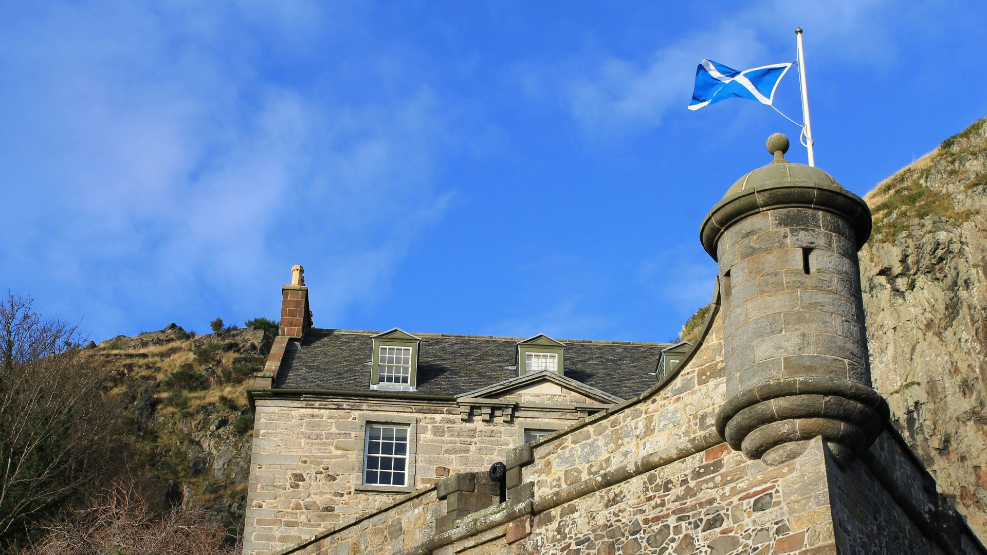 brown brick building under blue sky during daytime