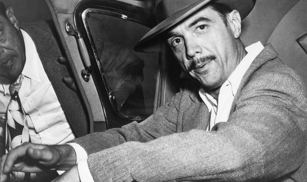 Howard Hughes Seated in Car
