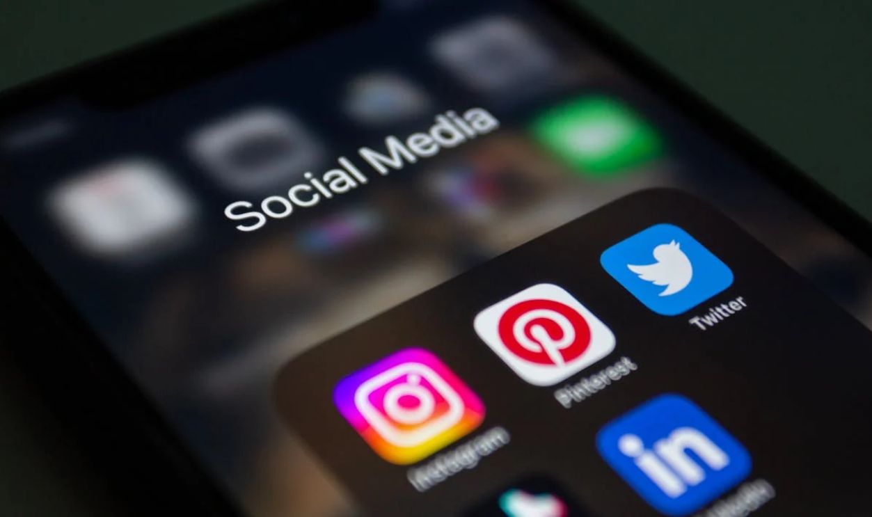 Close-up of a Smartphone Screen Displaying Social Media App Folder