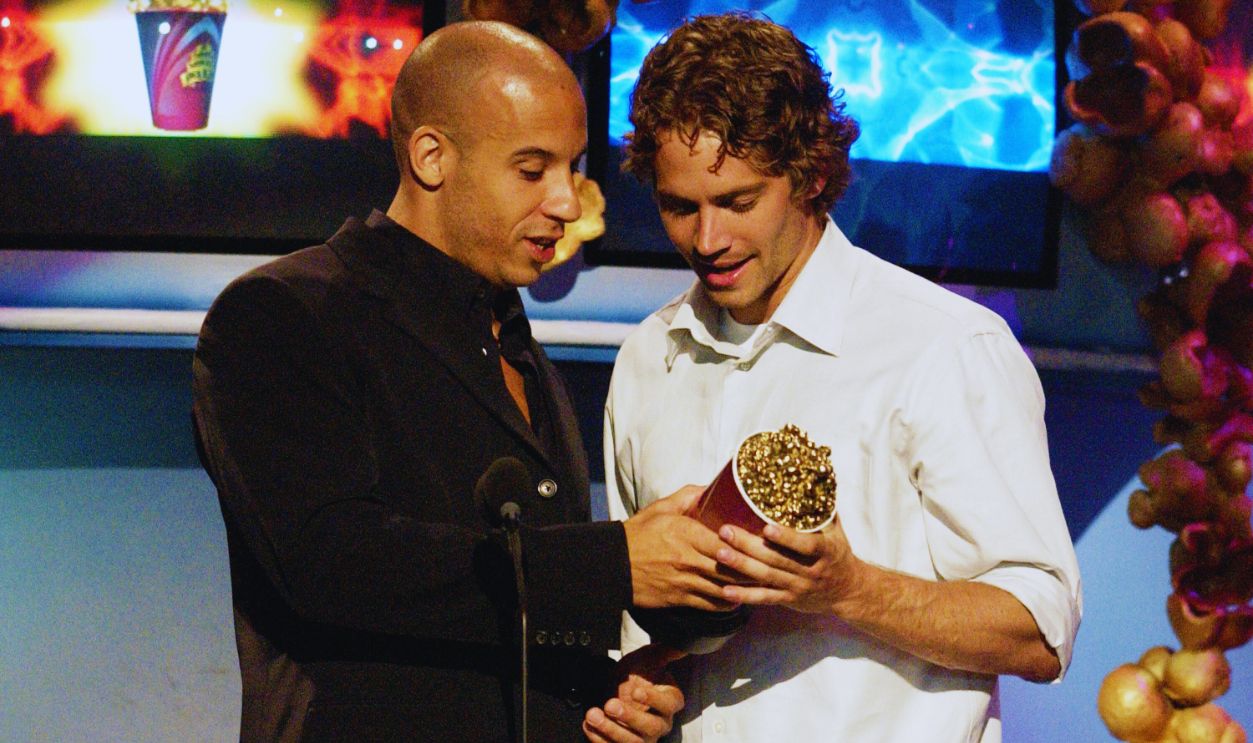 Gettyimages - 104804610, 2002 MTV Movie Awards - Show Actors Vin Diesel (L) and Paul Walker accept their award for Best On-Screen Team for their roles in the film 