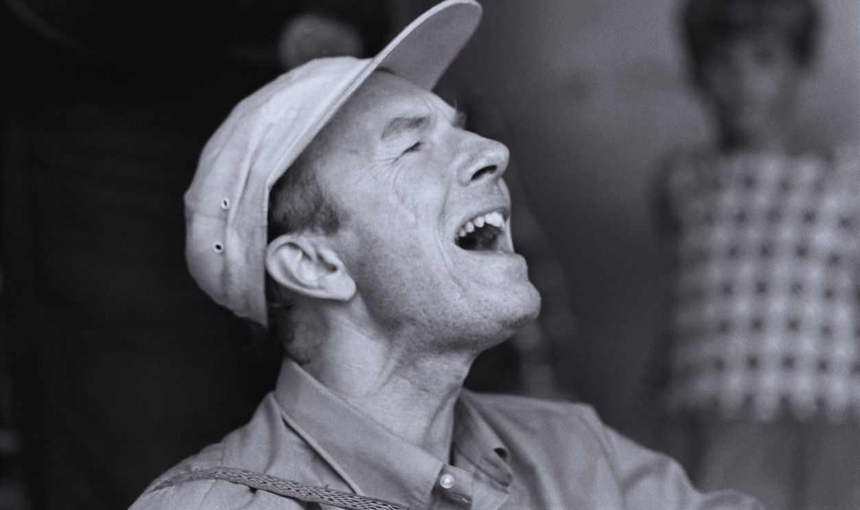 Gettyimages - 1302815313, Pete Seeger Performs At South Street Close-up of American musicians Pete Seeger (1919 - 2014) as he performs onstage at South Street, New York, New York, August 18, 1968. The performance was designed to raise awareness and money for the cleanup of the Hudson River.