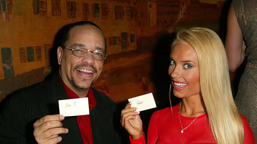 Ice T and his wife Coco hold up their seating cards