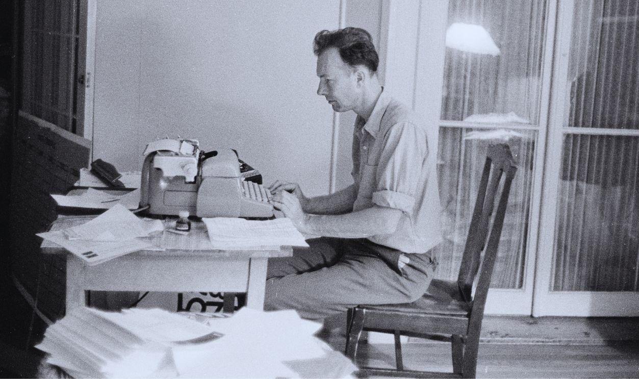 Gettyimages - 109481264, Pete Seeger At The Typewriter Pete Seeger sitting at the typewriter, during the Newport Folk Festival, 1963.
