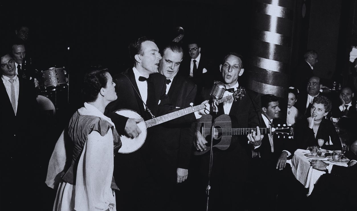Gettyimages - 56838333, The Weavers Perform At Cafe Society American folk music group the Weavers perform before an audience at Cafe Society Downtown, New York, New York, July 17, 1951. The group is, from foreground, Ronnie Gilbert, Pete Seeger on banjo, Lee Hays (1914 - 1981), and Fred Hellerman on guitar.